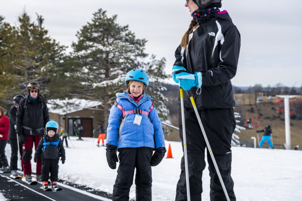 A smiling young skier on the slopes at Sundown